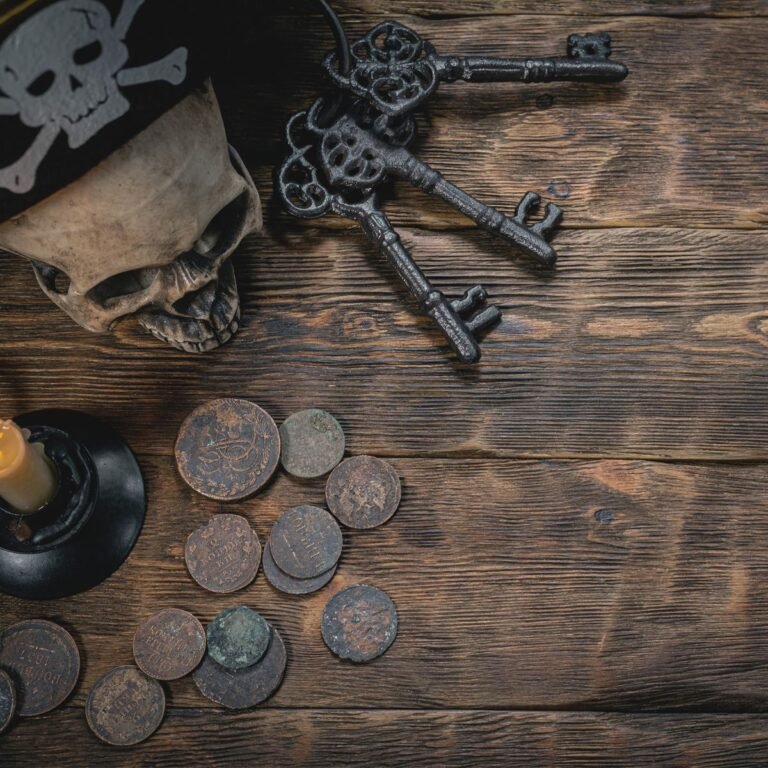 A skull, old keys, and coins on a table