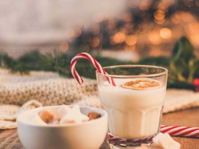 egg nog with a candy cane