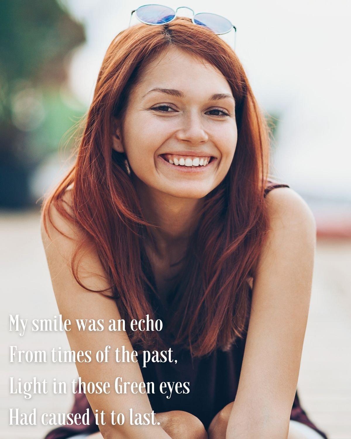 girl smiling sitting outside