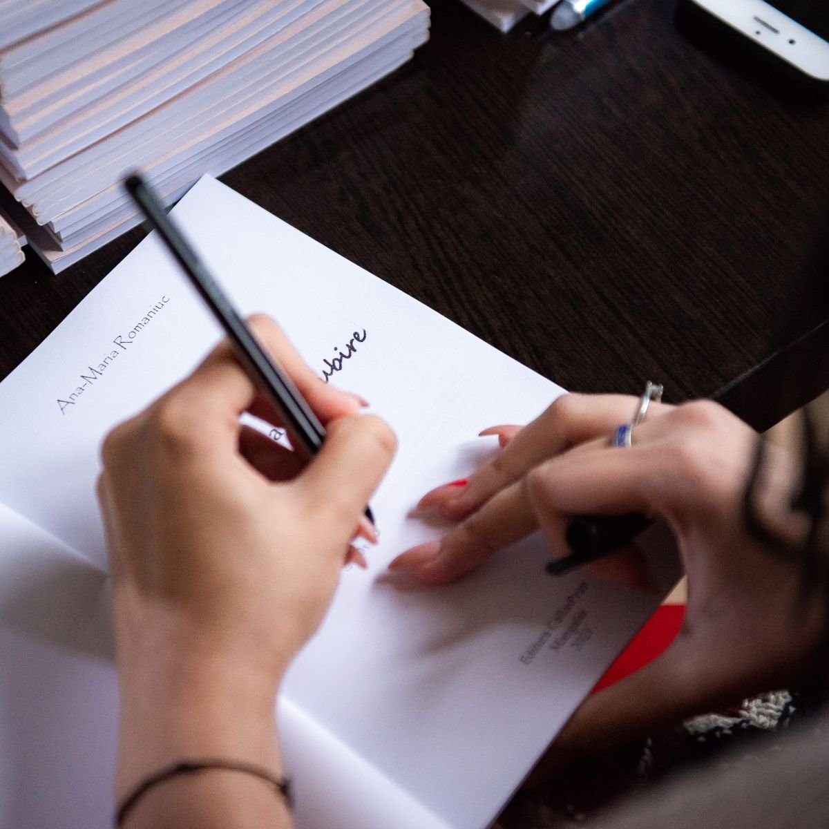 Person writing a love poem