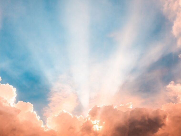 heavenly sun beams behind a cloud